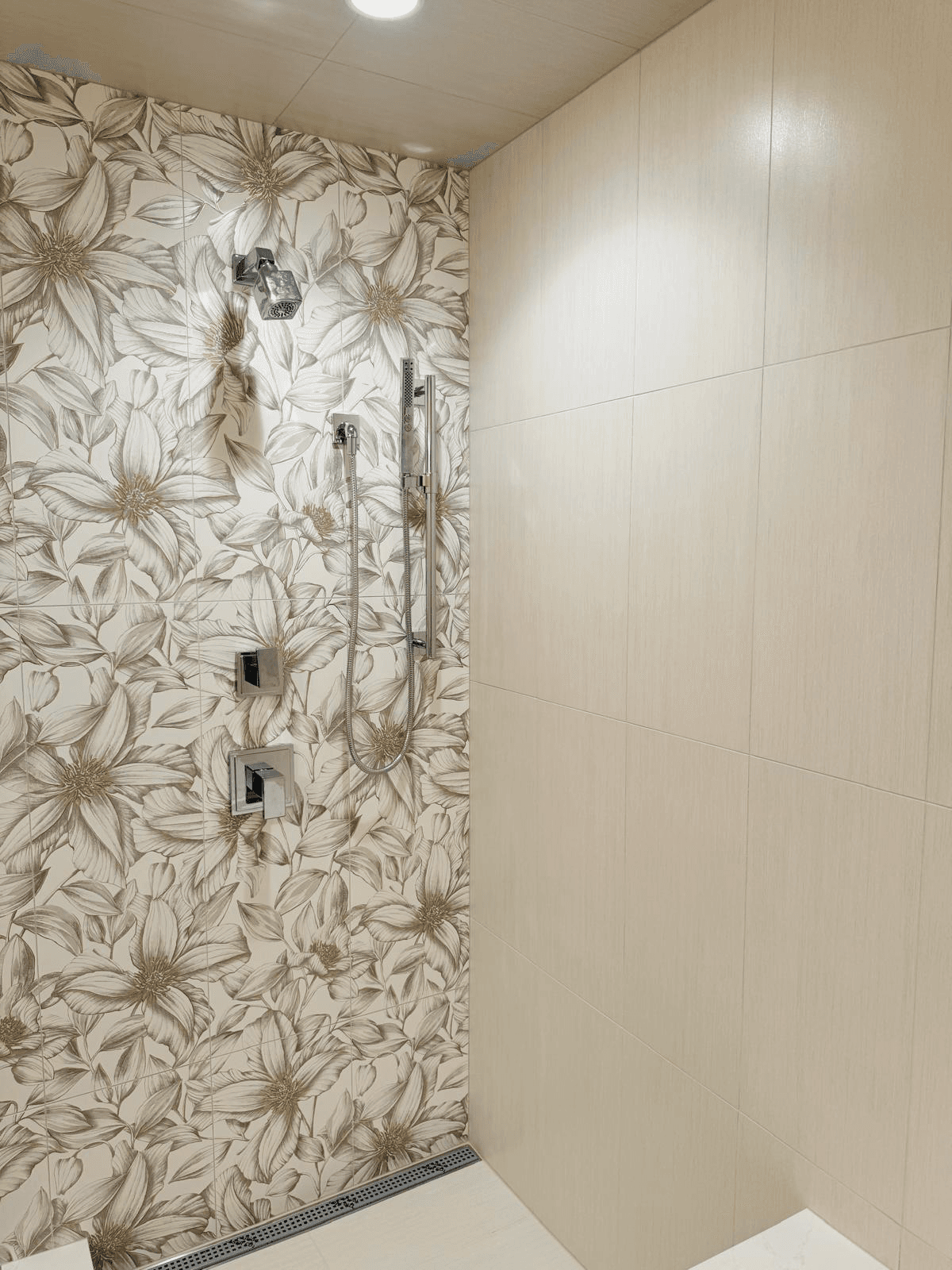 Custom floral shower tile installation
